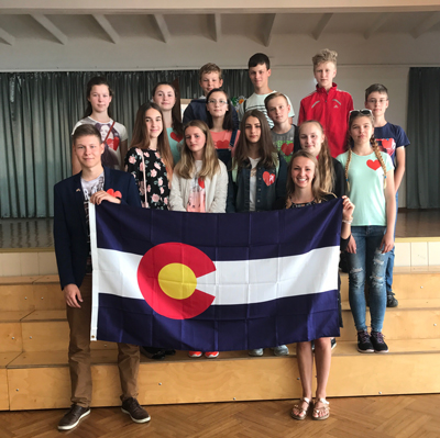Samantha Martell, front right, holds the Colorado state flag with her homeroom students. 