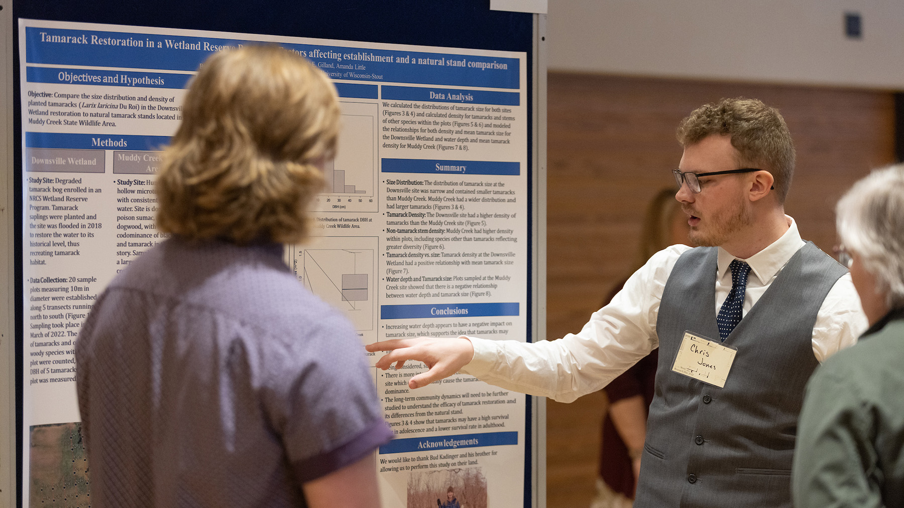 A student presents his research at Research Day.