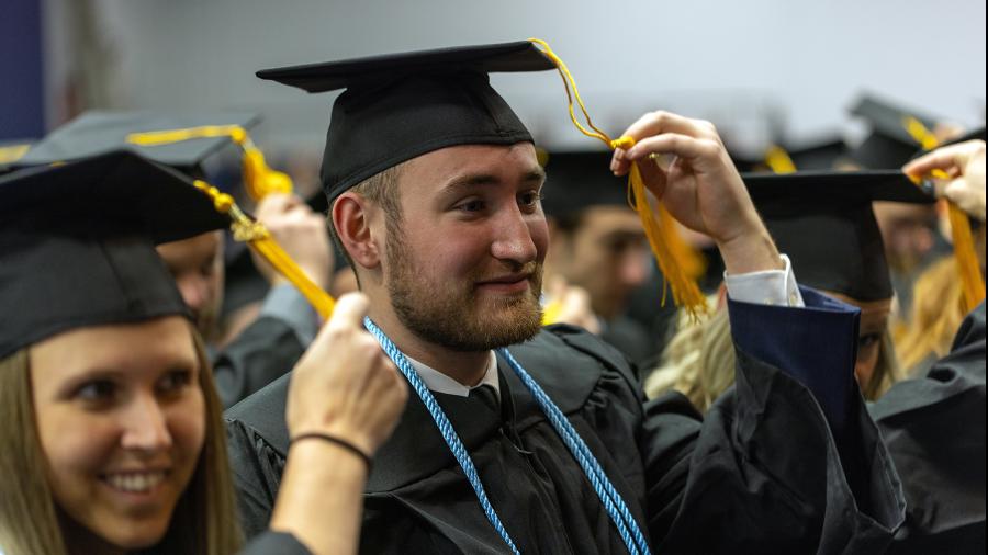 Bachelor degree graduates move the tassels on their mortarboards from the right to the left as part of the tradition to signify they have earned their degree.