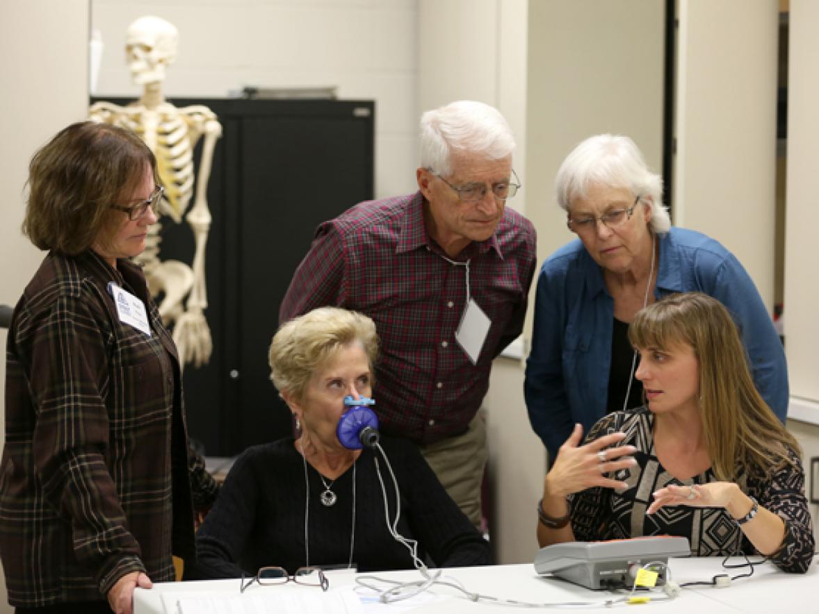 UW-Stout Associate Professor Kerry Peterson, front right, explains food pathogens during a demonstration at the 2016 Stout Summit.