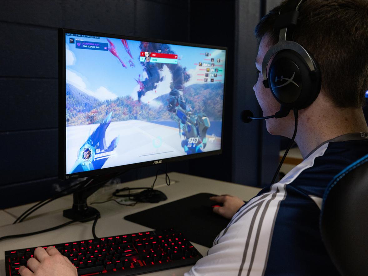 UW-Stout esports team players compete from their new arena in Heritage Hall. The arena includes new computers, monitors and chairs that are standard in competitive gaming.