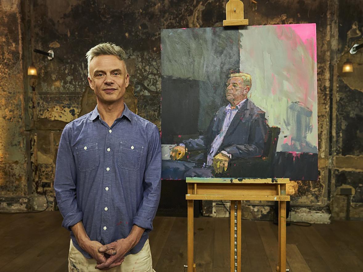 Tozer poses on the set of Portrait Artist of the Year with his painting of musician Suggs that won an opening round of the televised competition.